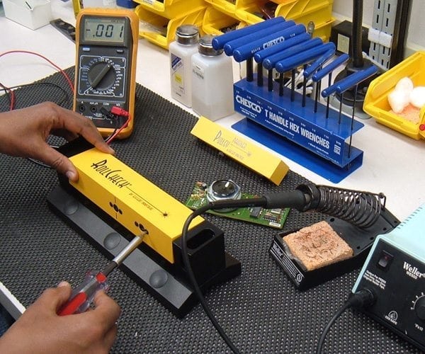 man using laser calibration & repair tools