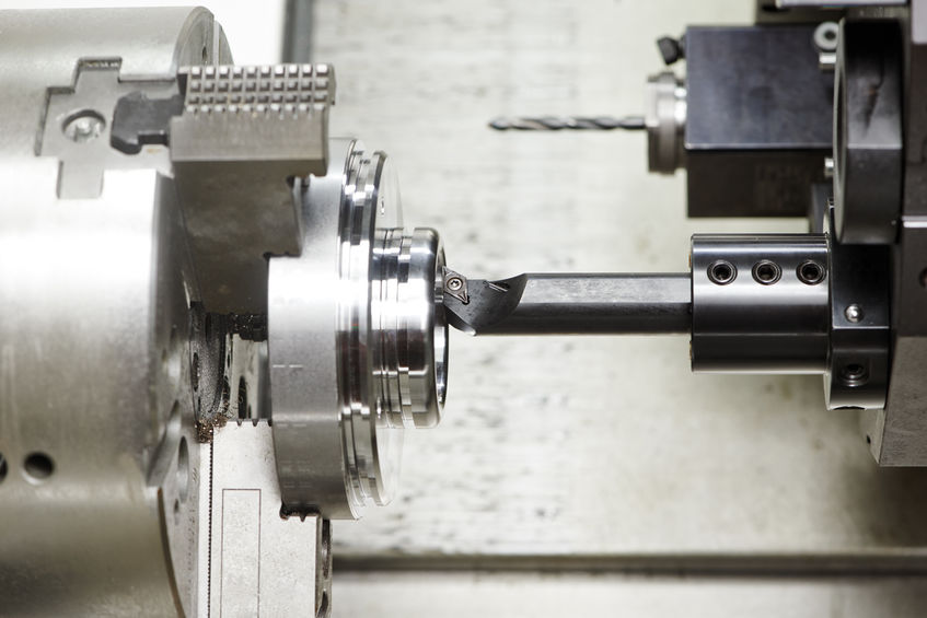 detail turning on metal cutting machine tool at manufacturing factory